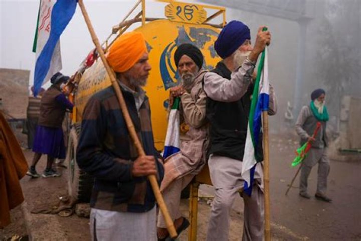 A young man dies as clashes erupt between police and protesting farmers in India