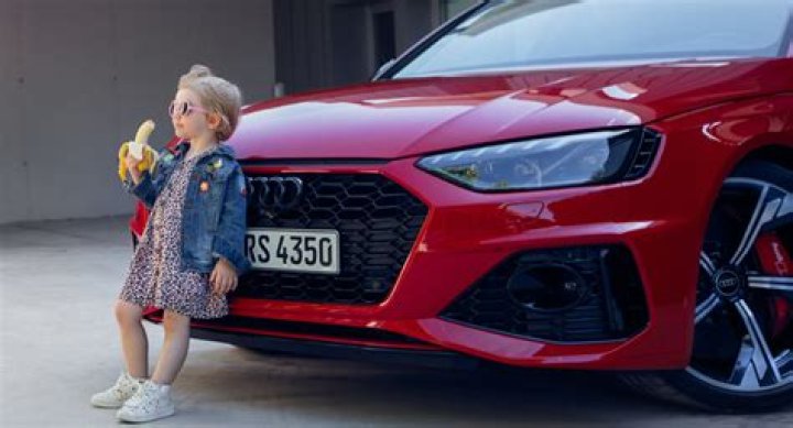 Audi drops 'disgusting sexually suggestive' advert featuring little girl eating a banana leaning on car
