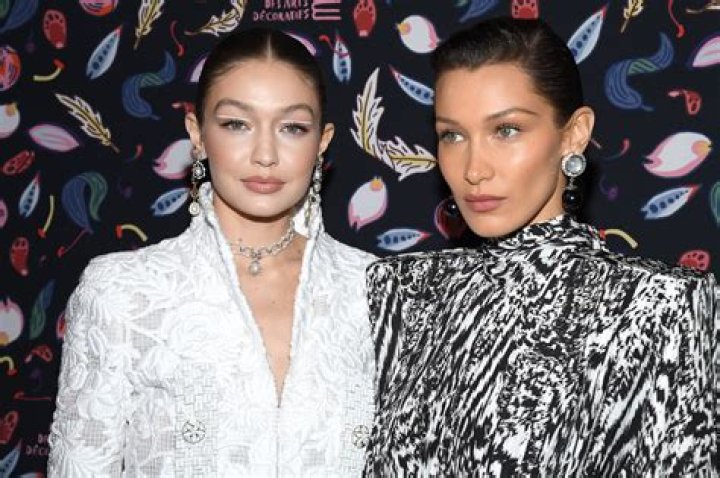 Bella and Gigi Hadid pose nude with SNAKE to recreate iconic Versace advert