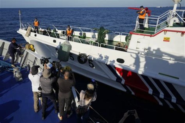 China coast guard flexes its might against the Philippines in disputed waters as journalists watch