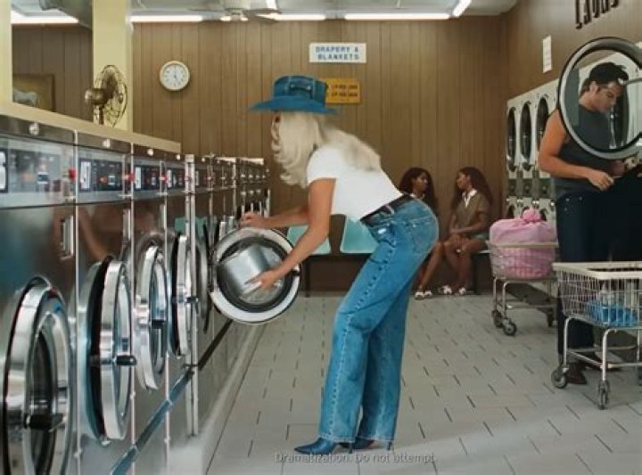 EastEnders' Barry goes topless for TV comeback on cleaning ad remake of iconic 1980s Levi's 'Laundrette' moment