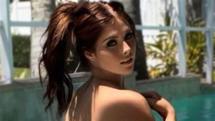 Ex-WWE star Brandi Lauren leaves nothing to the imagination as she flashes bum in the pool to tease OnlyFans content