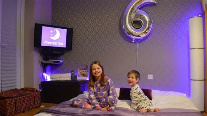 Family recreates Premier Inn for son's 6th birthday - including the logo and purple lights