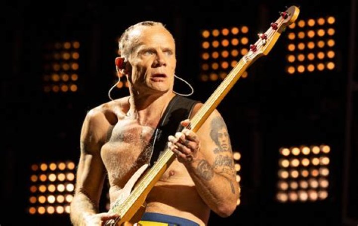Flea from Red Hot Chilli Peppers shows off his manhood and bottom as he goes completely naked on balcony