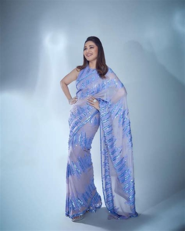 INSIDE PICS: Bhagyashree looks like dream in white saree; poses with Madhuri Dixit, Sanjay Kapoor at birthday party
