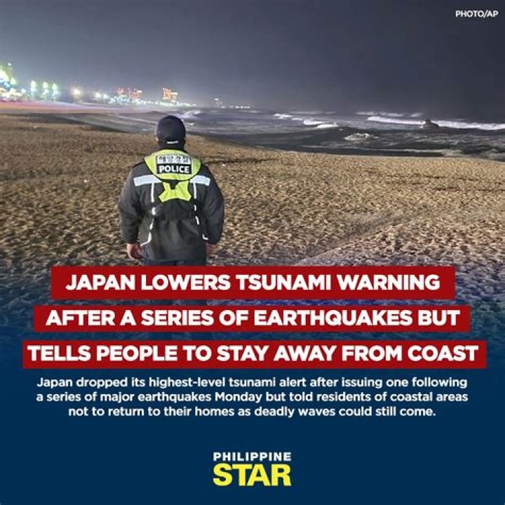 Japan lowers tsunami warning after a series of earthquakes but tells people to stay away from coast