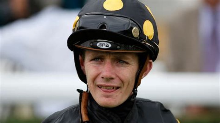 Jockey Kieran O'Neill being assessed on course after fatal fall for Goodwood Showman at Lingfield