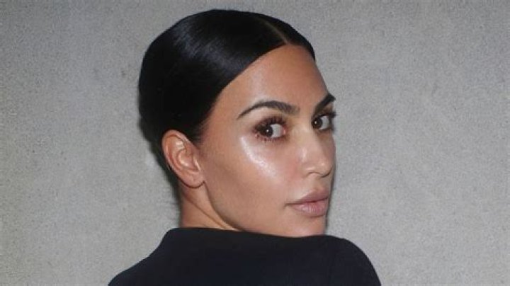 Kim Kardashian shows off bare butt in tiny black thong bikini as she hits the beach with longtime pal Stephanie Shepherd