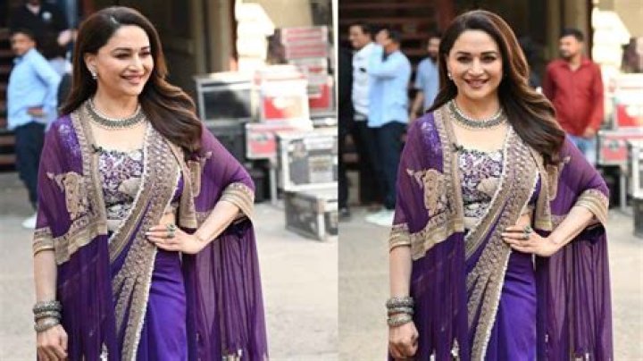 Madhuri Dixit gives Nisha vibes in purple saree with matching cape, evokes nostalgia