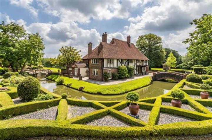 Mansion with its own moat, nine acres and ten bedrooms on market for £2.25m - and owner automatically becomes a Lord or Lady