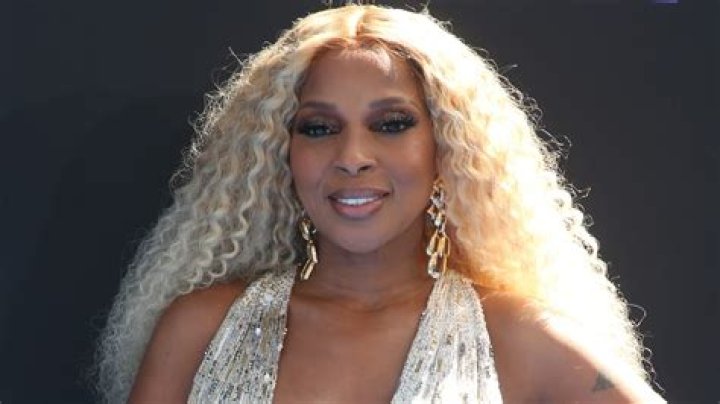 Mary J. Blige, 51, turns up the heat in sparkly cut-out dress and knee-high boots