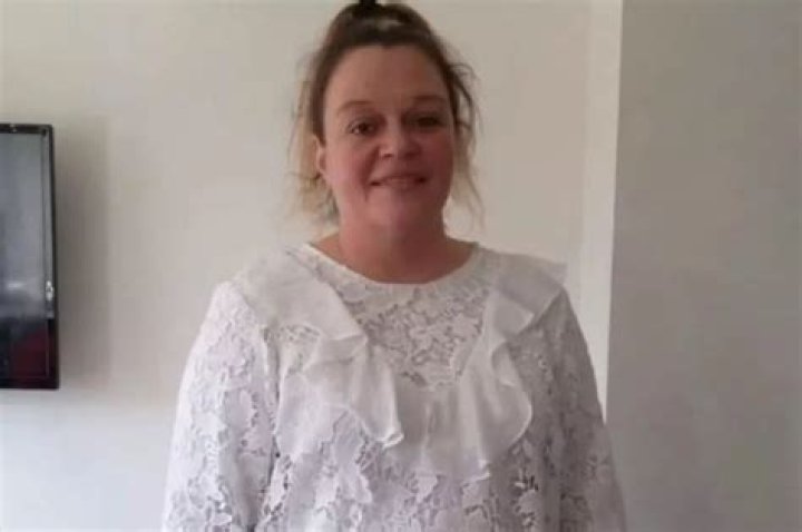 Mum, 44, found dead in Wigan tower block is named as 'dearly loved' Caroline Gore - with man, 56, charged with murder