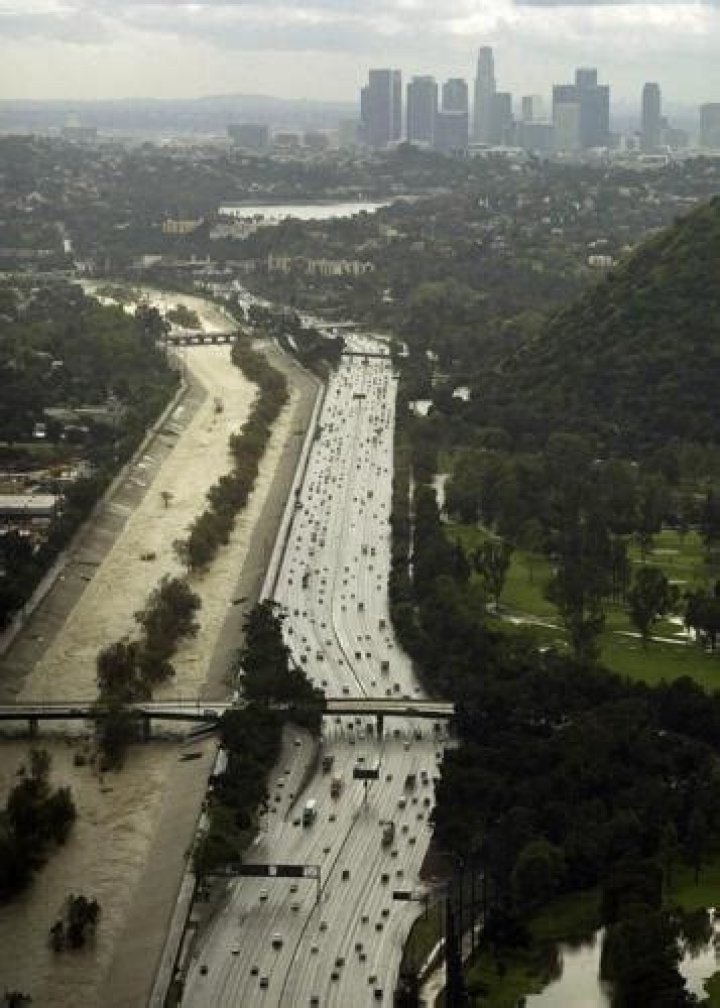 Normally at a crawl, the Los Angeles River threatens to overflow during torrential rains