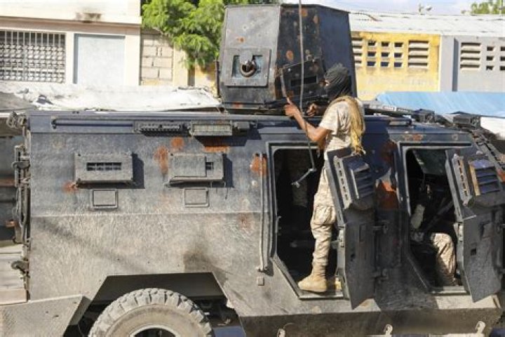 Police in Haiti struggle against gangs storming prison in latest surge of violence