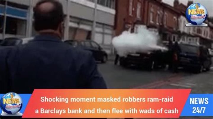 Shocking moment masked robbers ram-raid a Barclays bank and then flee with wads of cash