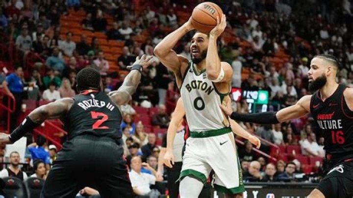 Tatum has 26 points and Celtics withstand late rally to beat Heat 110-106