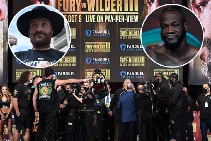 Tyson Fury weighs in almost THREE STONE heavier than Deontay Wilder for trilogy fight but pair are kept apart on stage