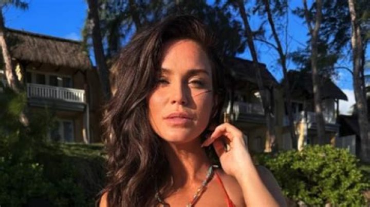 Vicky Pattison looks incredible in black bikini in Dubai as she sunbathes by the pool with a wine