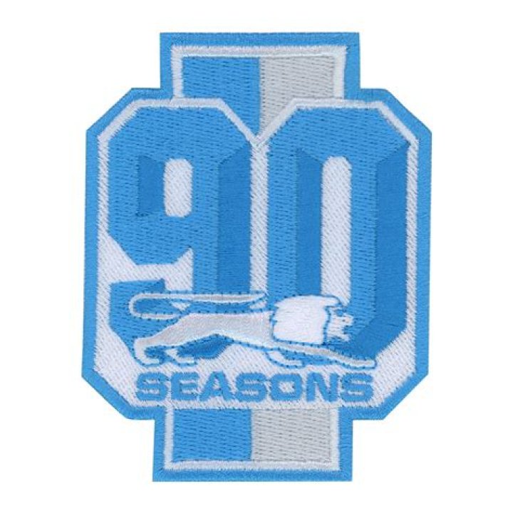 What does WCF stand for on the Lions jersey and what is the meaning of the ‘90’ patch in front of it?